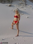 Sweet Susi. Red Lingerie in the sand Free Pic 1