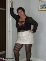 Kinky Carol. Leather Mini & Body Stocking Free Pic 1