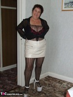 Kinky Carol. Leather Mini & Body Stocking Free Pic 2