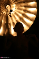 Malika. Naked by the umbrella lamp Free Pic 1