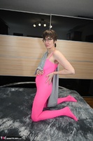 Hot Milf. Posing In A Pink Catsuit Free Pic 3