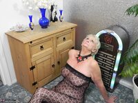 Sparkle. GILF in a crotchless body suit and mask Free Pic 10