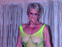Sparkle. GILF Sparkle looks hot in her flourescent green bodysuit Free Pic 1