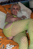 Sparkle. GILF Sparkle looks hot in her flourescent green bodysuit Free Pic 2