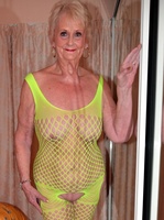 Sparkle. GILF Sparkle looks hot in her flourescent green bodysuit Free Pic 10