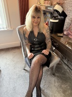 Inked MILF. Leather Skirt and Fishnet Stockings Free Pic 3
