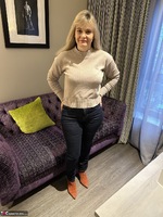 Inked MILF. Jeans Strip Free Pic 1