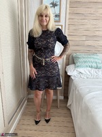 Inked MILF. Tight Black Dress and Purple Underwear Free Pic 1