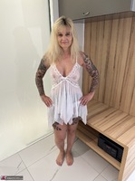Inked MILF. White see through dress and tanned tits Free Pic 1