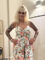 Inked MILF. Little shorts dress with orange underwear Free Pic 2
