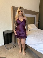 Inked MILF. Purple bed set with G string Free Pic 1