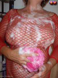 Busty Bliss Gets Red Net Body Stocking Soapy & Sudzy featuring Busty Bliss