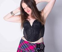 Fishnet Tights and Tartan Miniskirt featuring Reckless Temptation Free Pic 1