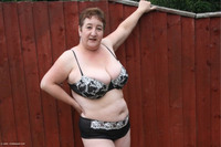 Stripping In The Garden Pt1 featuring Kinky Carol Free Pic 1