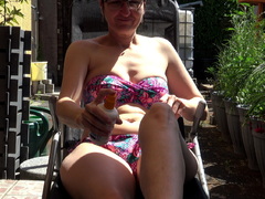 Hot Milf - Applying Lotion On The Terrace Gallery