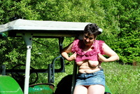 Stripping On The Tractor featuring Hot Milf Free Pic 1