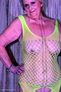 GILF Sparkle looks hot in her flourescent green bodysuit featuring Sparkle
