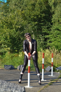 Catsuit By The Gate featuring Hot Milf