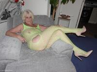 Wearing a bright yellow crutchless yellow body suit.  featuring Sparkle Free Pic 1