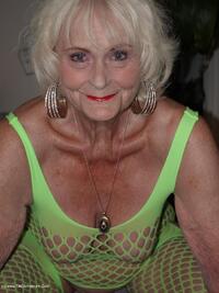 Wearing a bright yellow crutchless yellow body suit.  featuring Sparkle